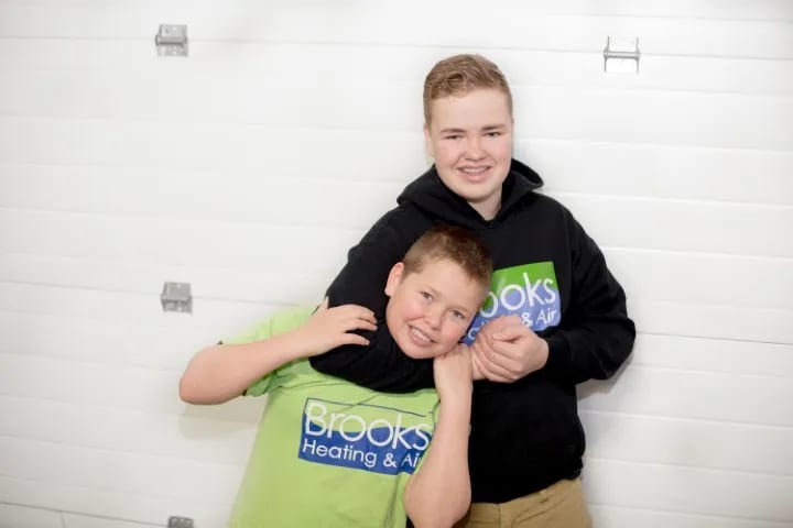 The Brooks boys in their green Brooks Heating & Air shirts