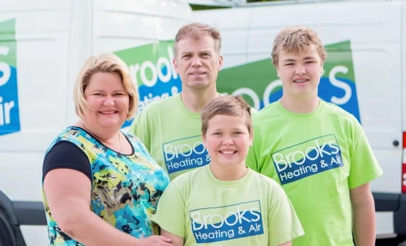 Nathalie and Chris Brooks with their sons — the family behind Brooks Heating & Air in Georgetown, Ontario