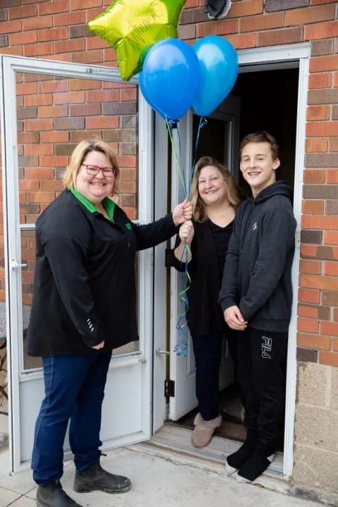 Delivering balloons to the winner of the Brooks furnace giveaway