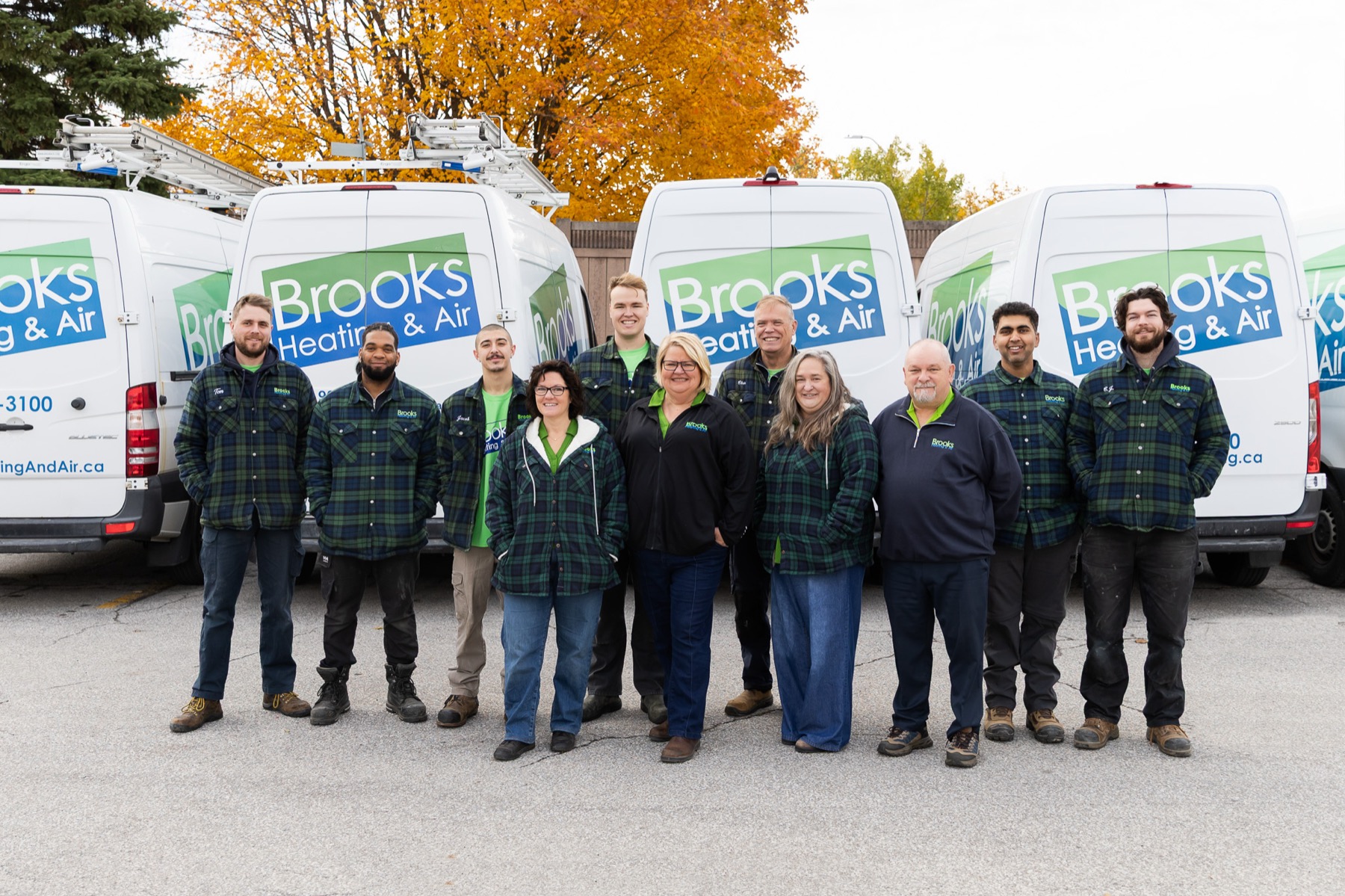 The full Brooks Heating & Air team together in their green shirts