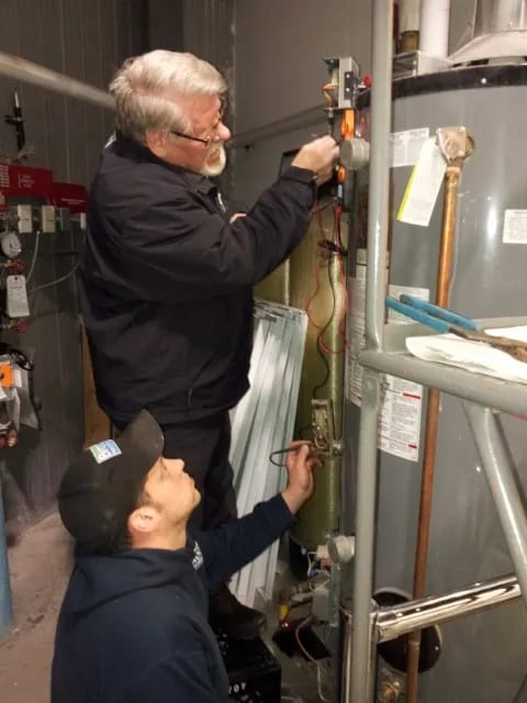 Learning the trade from Nathalie's dad on a water heater install