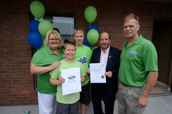 The team celebrating the opening of the Brooks Heating & Air shop
