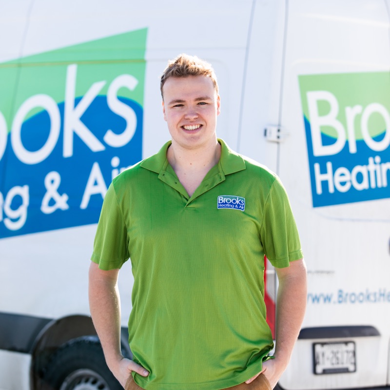 A Brooks Heating & Air team member by the company van